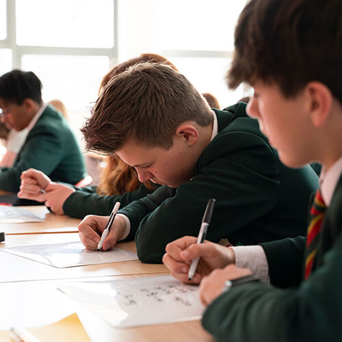 Students writing on paper
