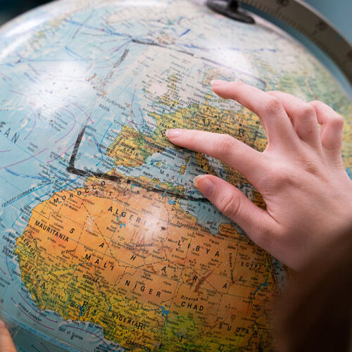 Hand over a globe