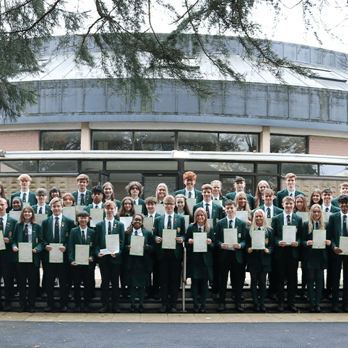 Students stood in front of a school