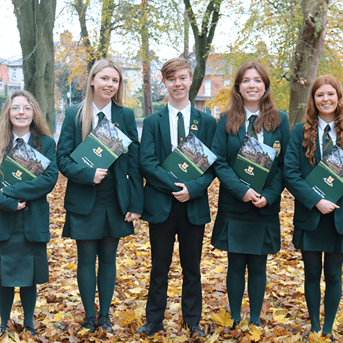 Students holding a brochure