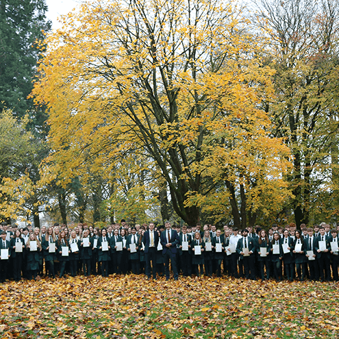 Students holding a brochure