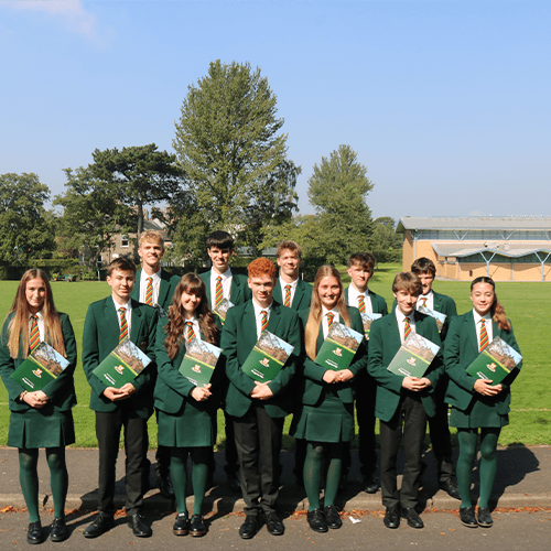Students holding a brochure