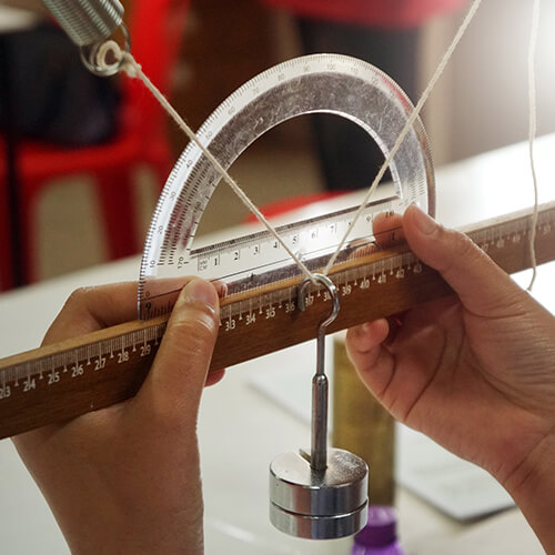 Hands holding a ruler