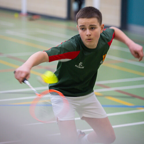 Student playing badminton