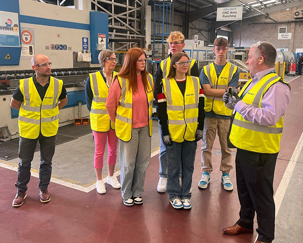 Students receiving a factory tour