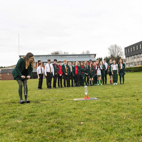 Students outside on grass