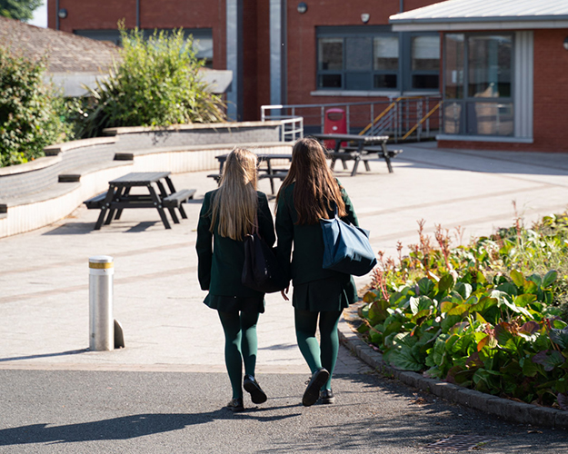 Two students walking in the distance